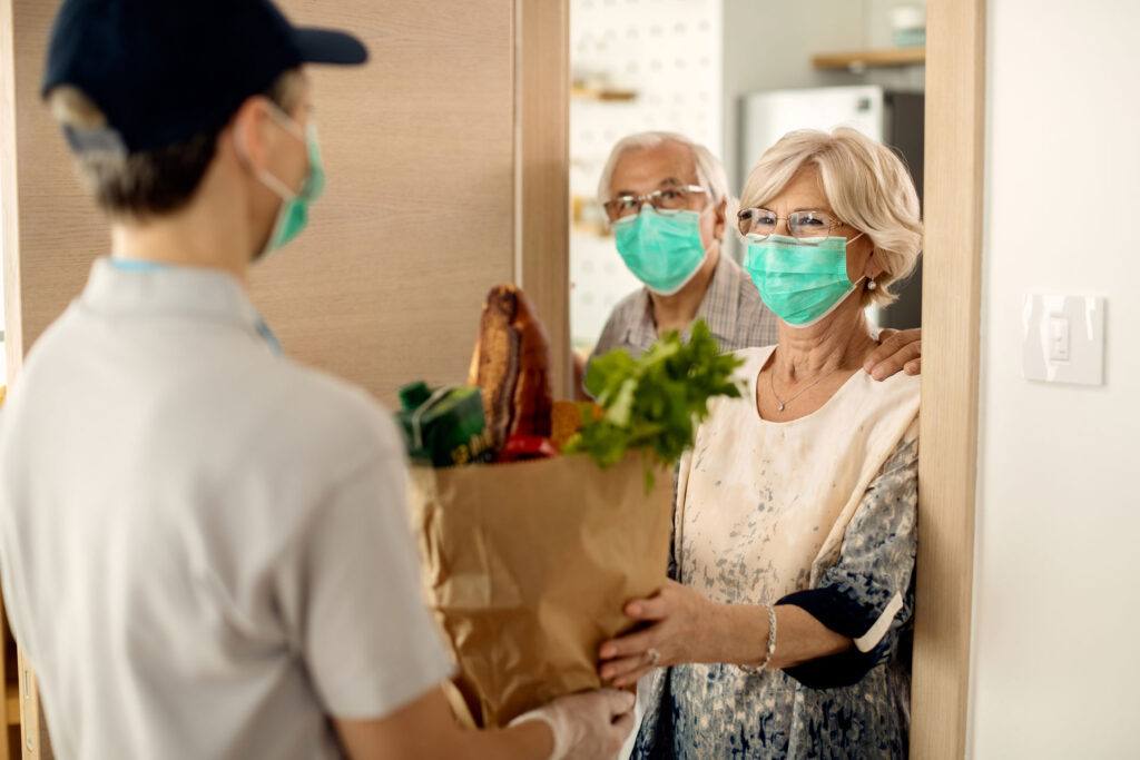 happy-mature-woman-her-husband-receiving-groceries-home-coronavirus-epidemic
